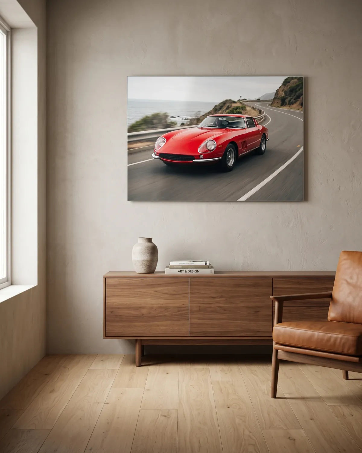 Classic red sports car on a coastal road, printed on metal in a bright Australian living room