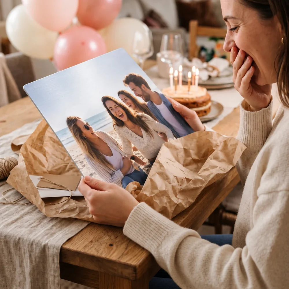 Woman surprised by a personalised metal photo print birthday gift