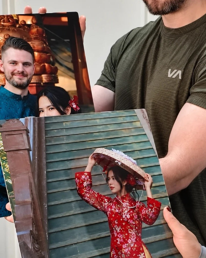 Customers unboxing MagnetArt metal photo print showing finished wall art product